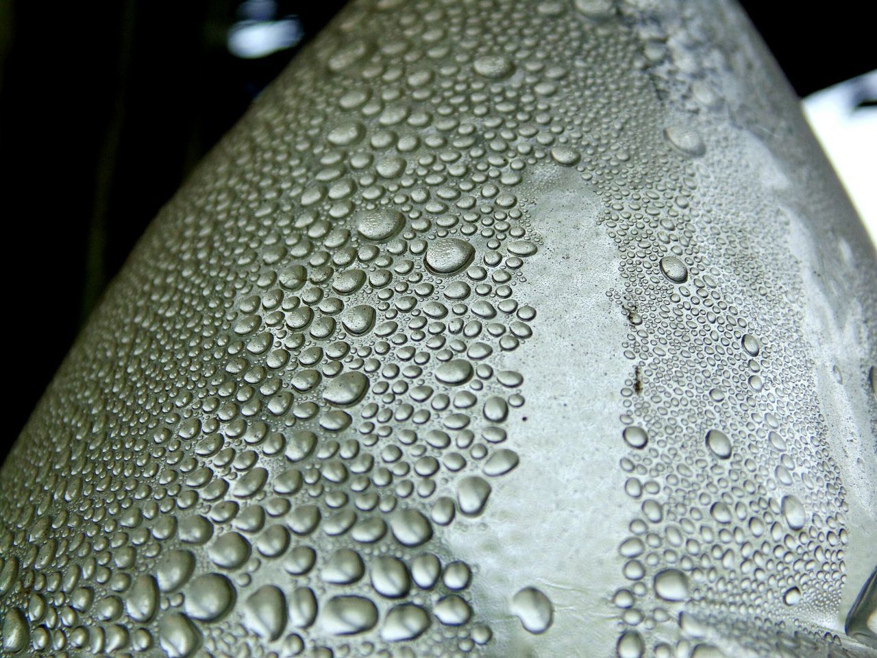 DETAIL SHOT OF WATER DROPS ON GLASS