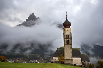 Historic building against cloudy sky