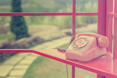 Close-up of telephone in booth
