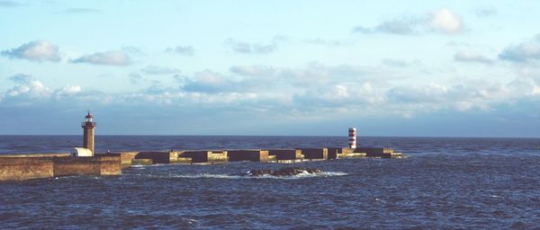 View of lighthouse against calm sea