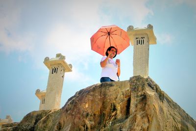 Low angle view of statue against sky