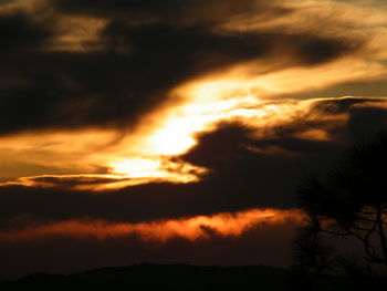 Low angle view of dramatic sky during sunset