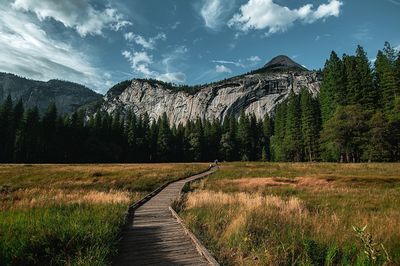 Scenic view of landscape against cloudy sky