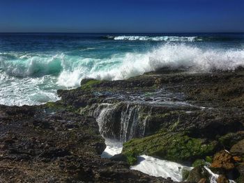 Waves splashing on rocks