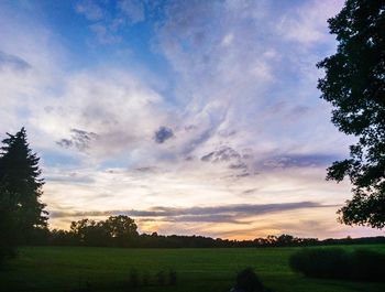 Scenic view of field against sky during sunset