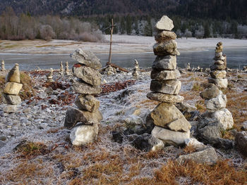 Stack of rocks in water during winter