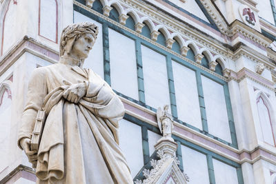 Low angle view of statue against sky