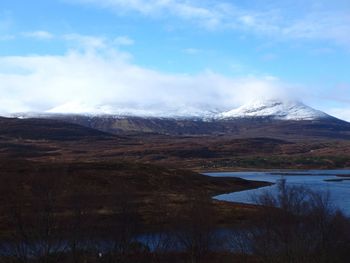 Scenic view of snowcapped mountains against sky