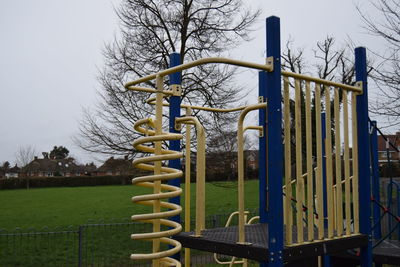 Playground in park against sky