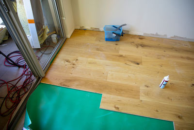 High angle view of chair on hardwood floor at home