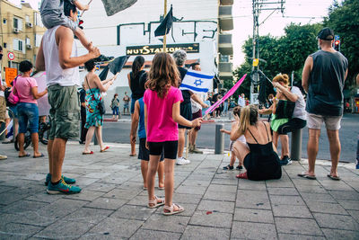 People on street in city