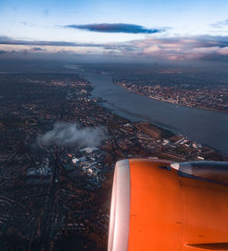 Aerial view of cityscape and jet engine