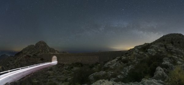 Low angle view of mountain against sky at night