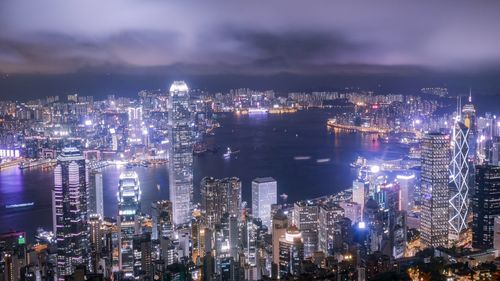 High angle view of illuminated city buildings at night