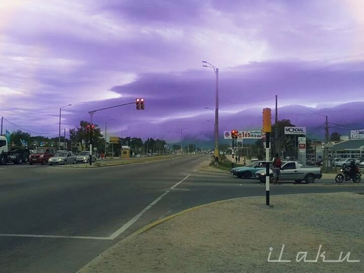 VIEW OF ROAD AGAINST CLOUDY SKY