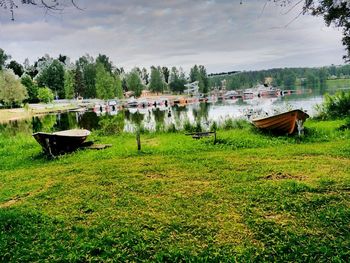 Scenic view of lake against cloudy sky