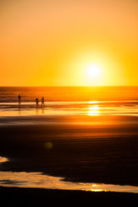 Scenic view of beach during sunset