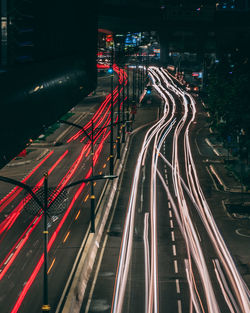 High angle view of light trails on highway at night