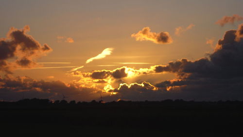 Scenic view of silhouette landscape against sky during sunset