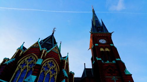 Low angle view of clock tower against sky