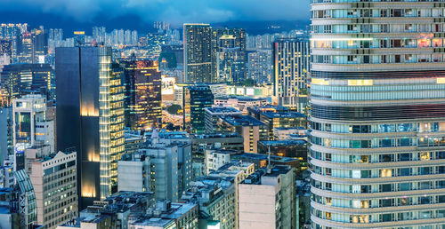 High angle view of modern buildings in city against sky