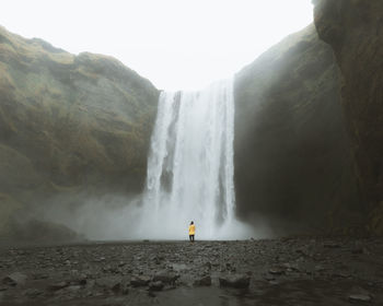 Scenic view of skogafoss waterfall against sky