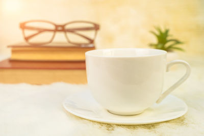 Close-up of coffee cup on table