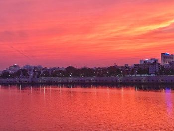 Scenic view of lake against romantic sky at sunset