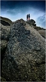 Full length of woman standing on rock