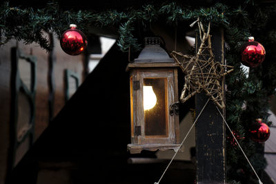 Illuminated lantern hanging on christmas tree