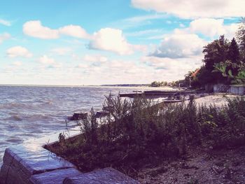 Scenic view of sea against cloudy sky