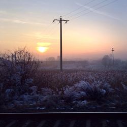 Electricity pylons on landscape