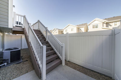 Staircase by building against clear sky