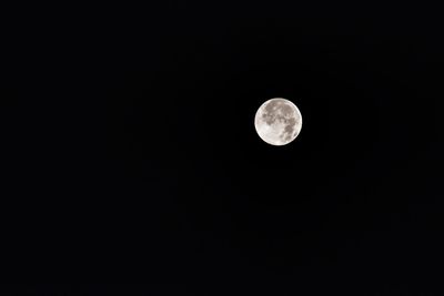 Low angle view of moon against clear sky at night