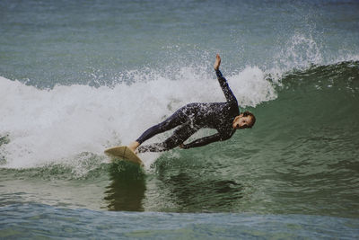 Man surfing in sea