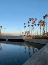 Scenic view of lake against clear blue sky