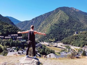 Full length of man on mountain against clear sky