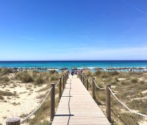 Scenic view of sea against clear blue sky