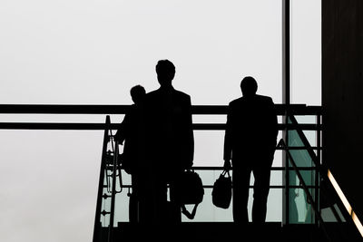 Low angle view of silhouette people on steps