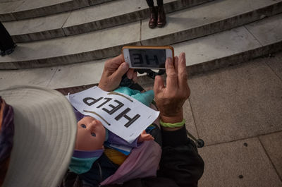 High angle view of man using mobile phone in city