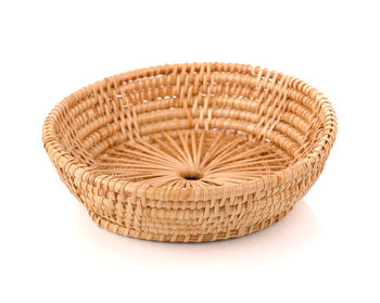 Close-up of wicker basket on white background