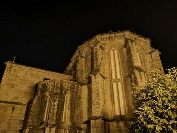 Low angle view of temple against sky at night