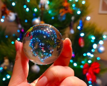 Close-up of hand holding christmas decoration