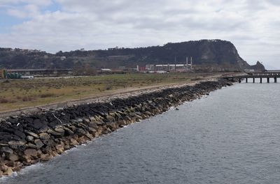 Scenic view of groyne against sky