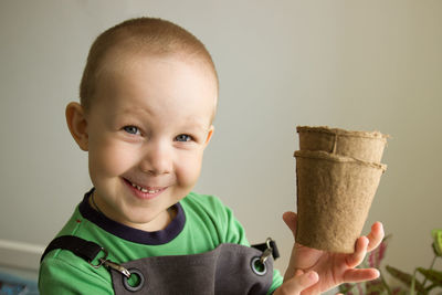 Portrait of smiling boy holding ice cream