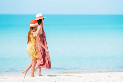 Woman with umbrella on beach