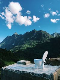 Scenic view of mountains against blue sky