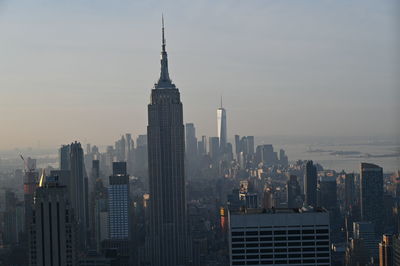Modern buildings in city against sky