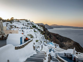 High angle view of buildings by sea against sky