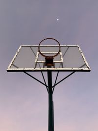 Low angle view of basketball hoop against sky